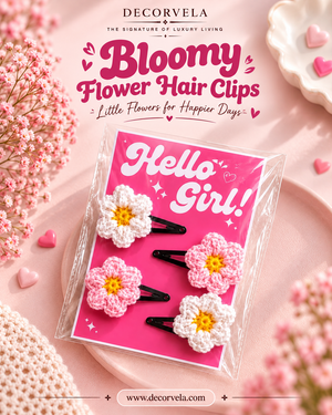 Decorvela Bloomy Flower Hair Clips in a clear plastic package with a pink 'Hello Girl!' card. The set includes four crocheted flower hair clips with pink, white, and yellow details, styled on a pink background with decorative flowers and hearts.