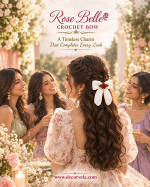 A woman in a floral dress shown from the back, wearing a large white crocheted bow with a small red rose accent in her hair. Other women and floral decorations are blurred in the background, with the text 'Rose Belle CROCHET BOW' and 'A Timeless Charm That Completes Every Look' at the top.