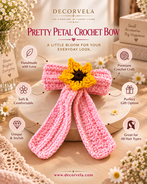 A pink crocheted petal bow with a yellow flower center, displayed on a wooden box with decorative flowers and gift-themed props. The image includes marketing text and icons for features like handmade quality, soft comfort, and suitability for all hair types.