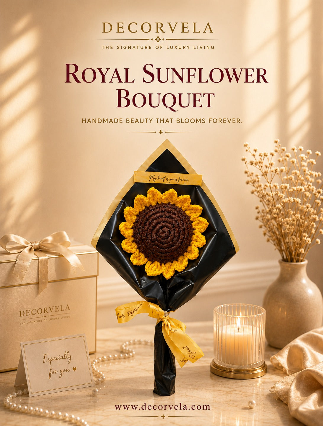 DecorVela Royal Sunflower Bouquet featuring a handmade crocheted sunflower with yellow petals and a dark brown center, wrapped in black paper with a gold ribbon, displayed on a table with a gift box, dried flowers, and a lit candle.